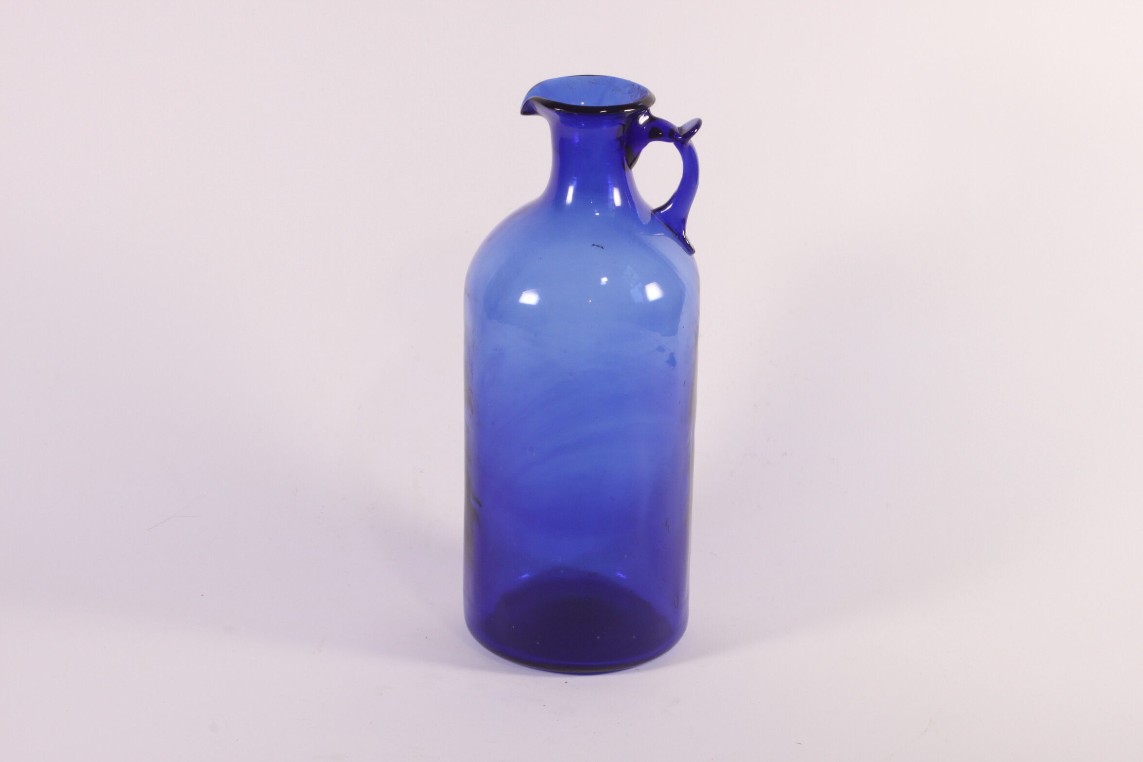 Antique handblown cobalt blue pitcher bottle, ca 1900.