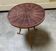 Tripod gueridon in Indian rosewood veneer.