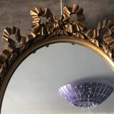 Oval golden mirror