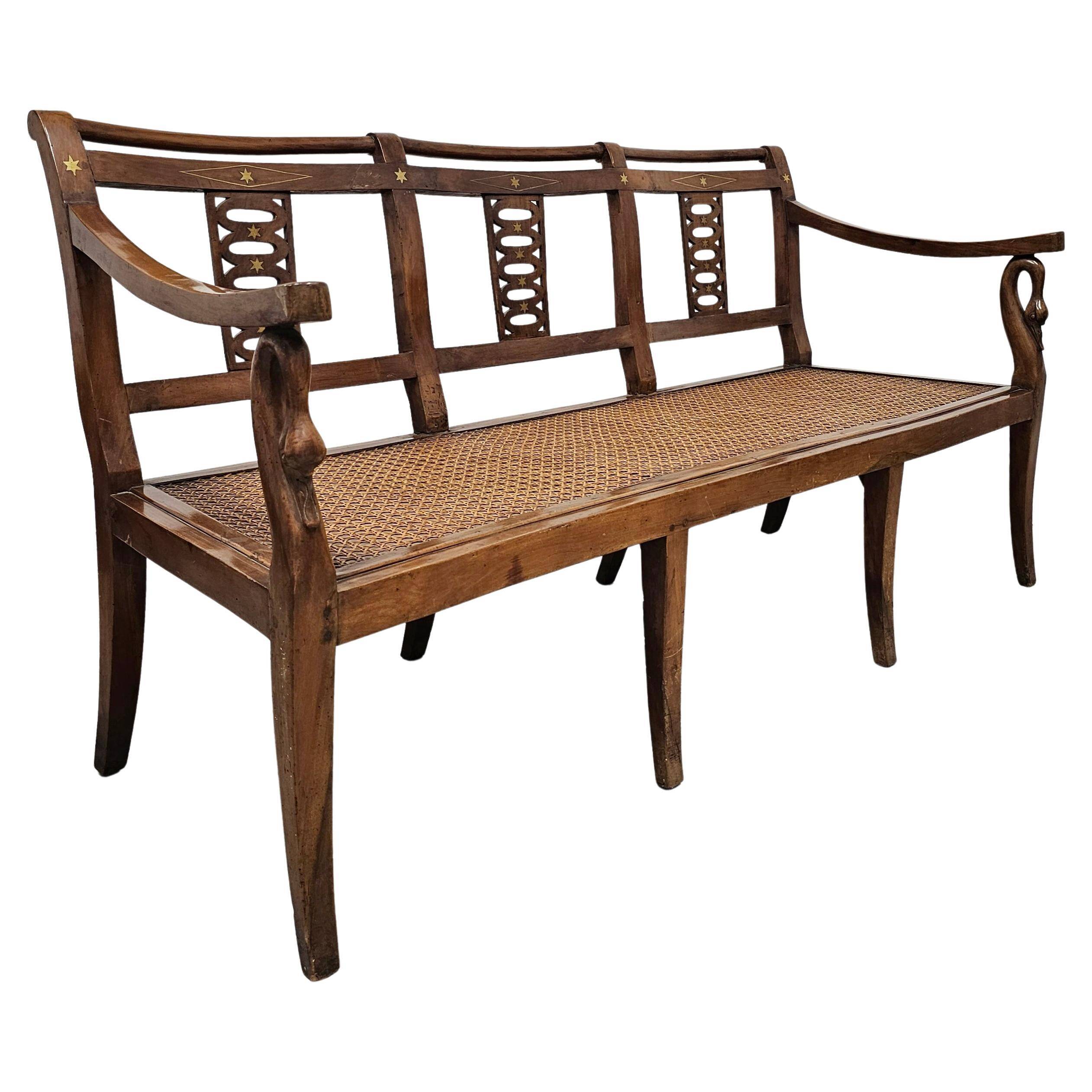 Directoire canapé in walnut with brass inlays, late 18th century.