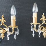 Pair of gilded bronze sconces and crystal pendants