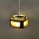 Danish hanging lamp, made in brass colored and brown metal, with yellowish hard pressed plastic deta