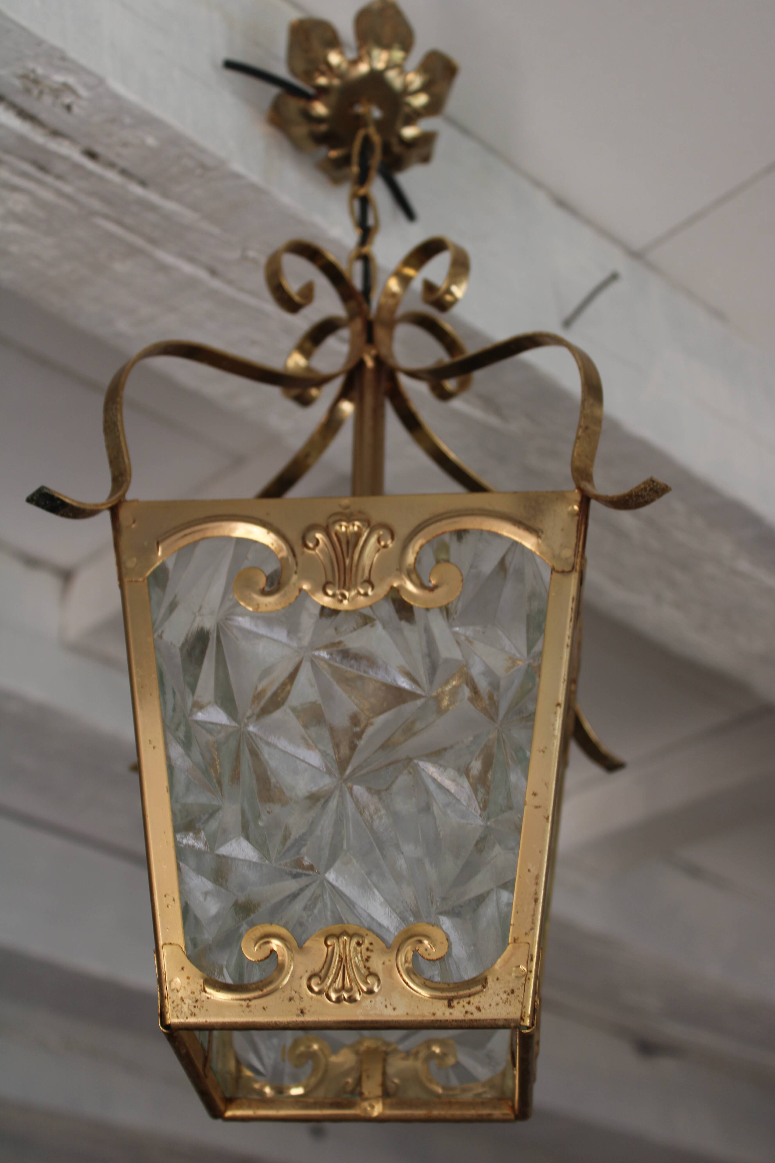 Glass and brass suspension