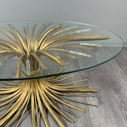 Gold metal and glass coffee table, 20th century, in the style of Robert Goos.