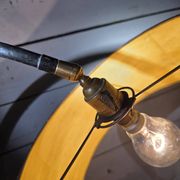 Tripod floor lamp in Matégot style from the 1950s.