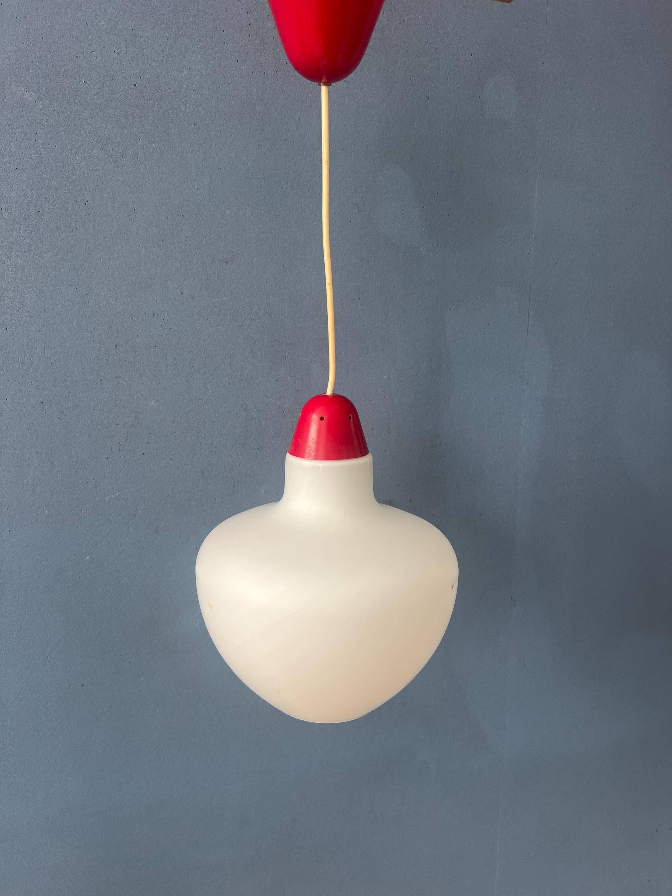 Mid-Century opaline glass suspension with a red upper part and ceiling cover.