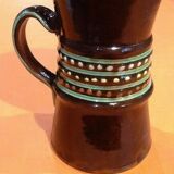Glazed terracotta pitcher decorated with beaded friezes