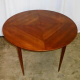 Mahogany round table with 4 extensions from the 1950s