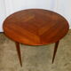 Mahogany round table with 4 extensions from the 1950s