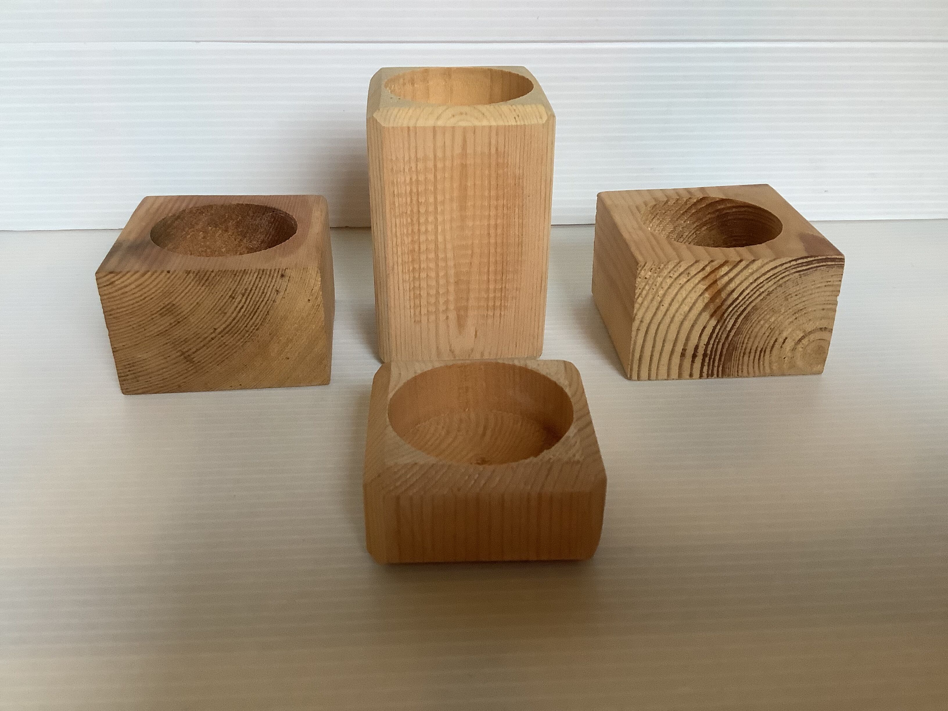 Set of four scandinavian wooden candle holders