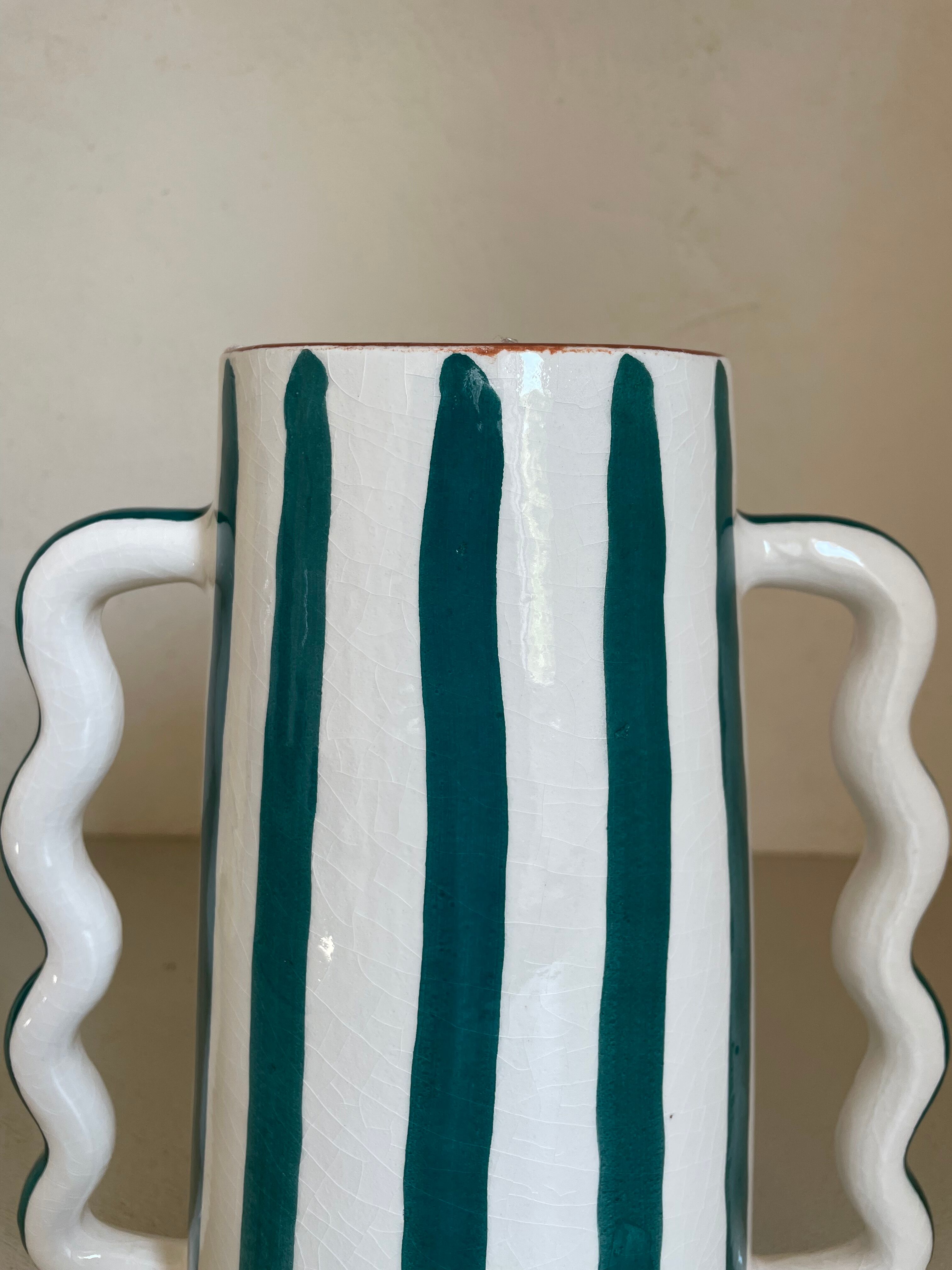 Fir and white green striped ceramic vase with handmade abstract wavy handles