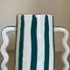 Fir and white green striped ceramic vase with handmade abstract wavy handles