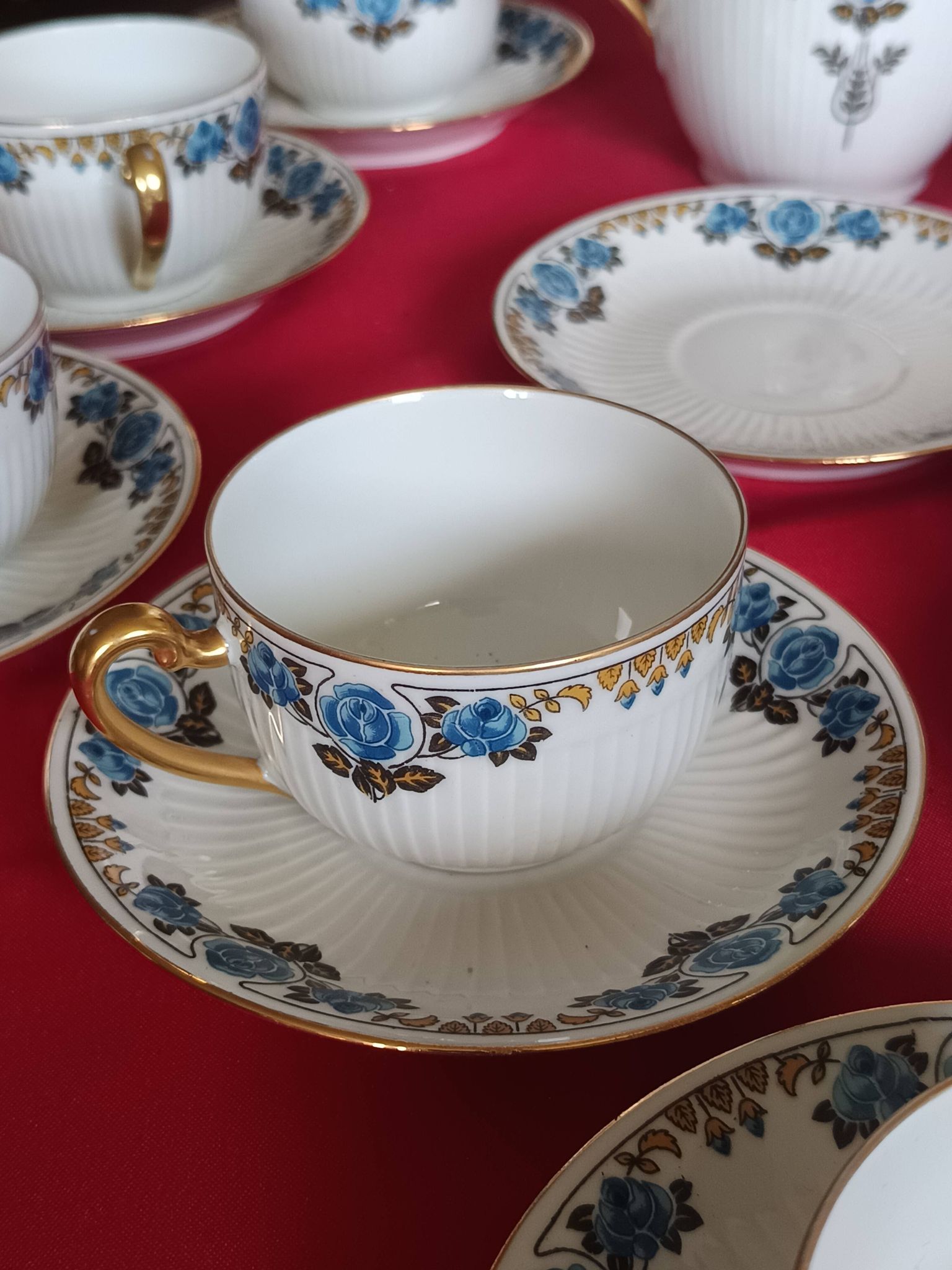 Antique Limoges porcelain coffee/tea service – 14 pieces with blue rose decoration.