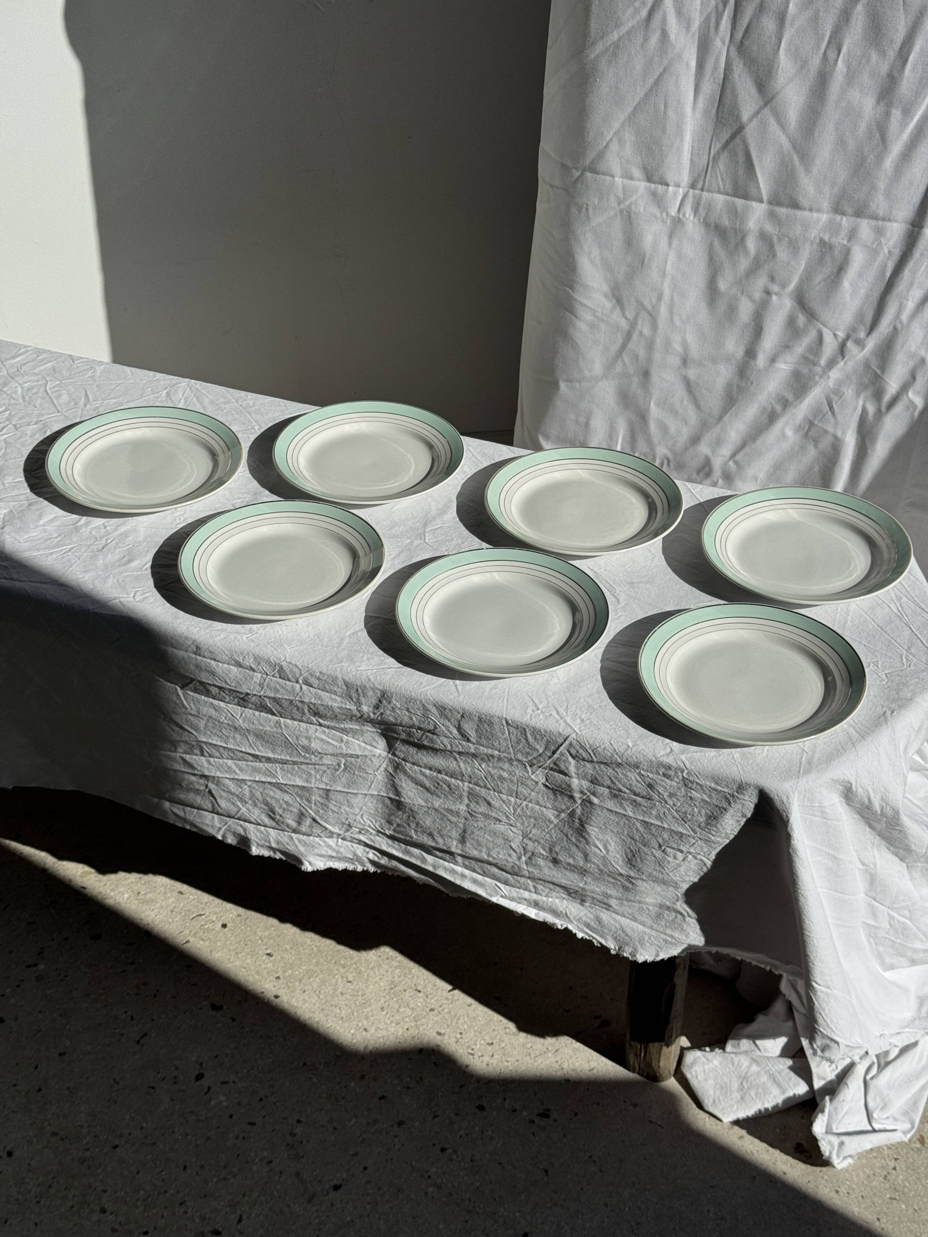 Set of 7 antique flat plates in turquoise earthenware with a gold rim D22