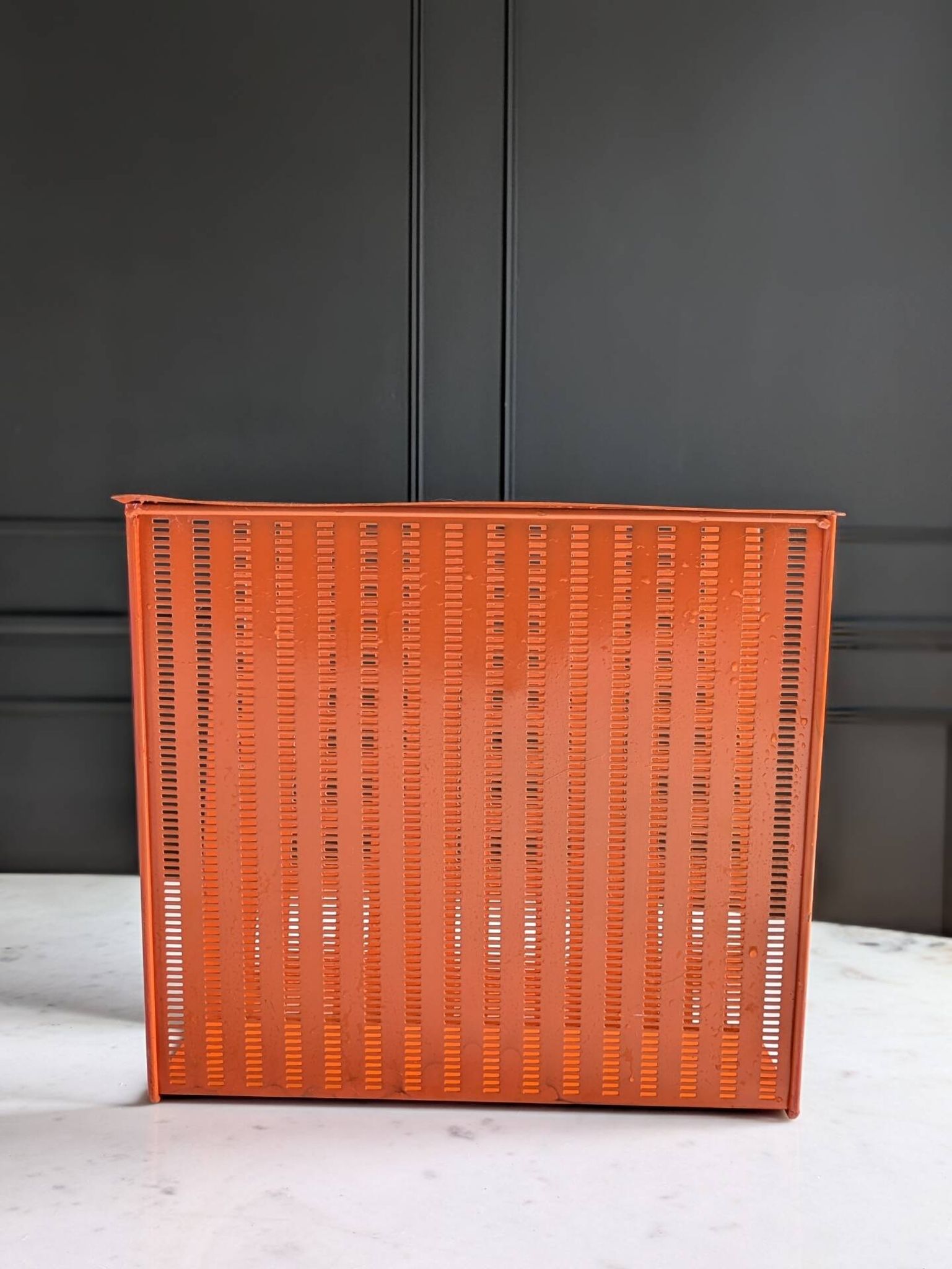 Vintage metal magazine rack in perforated orange/Mathieu Mategot style/70s
