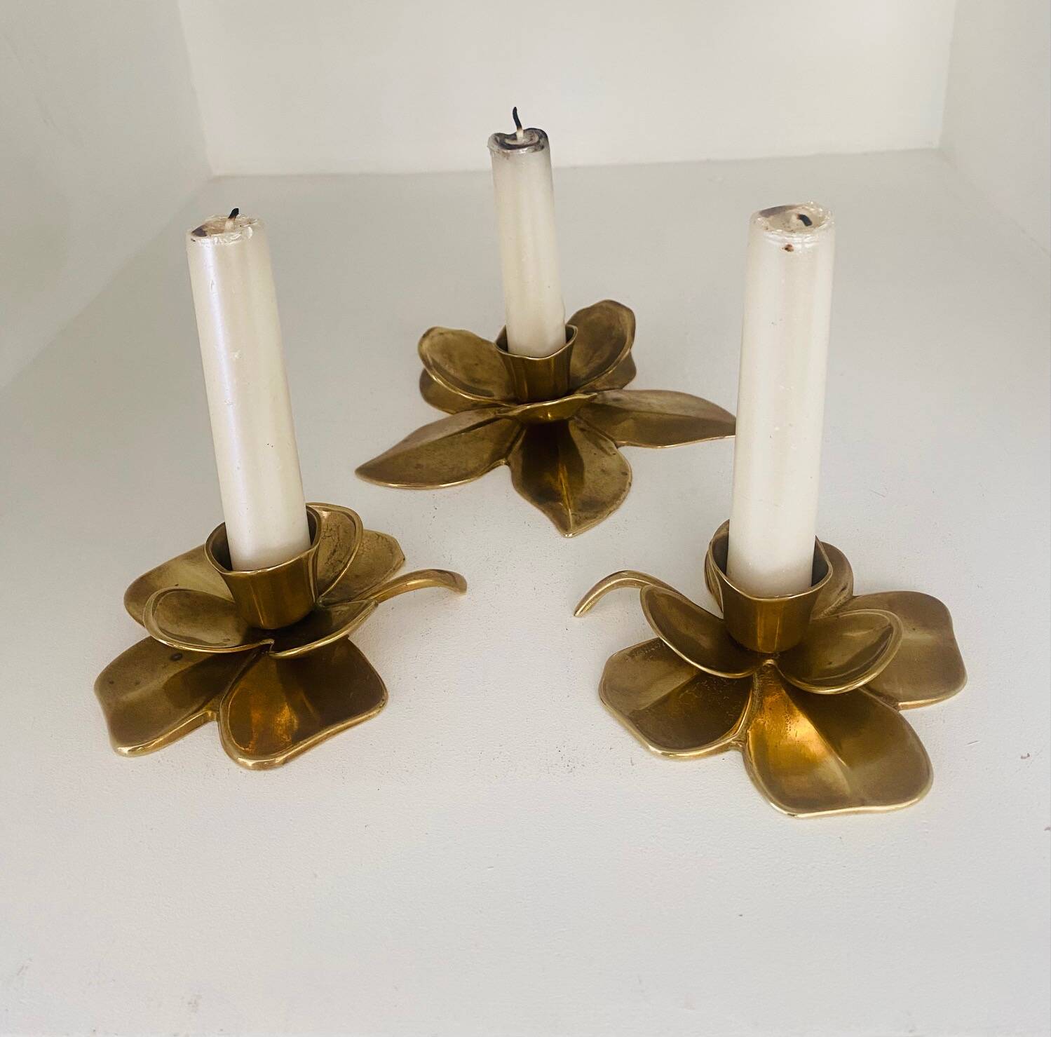 Set of 3 old brass candlesticks in the shape of flowers