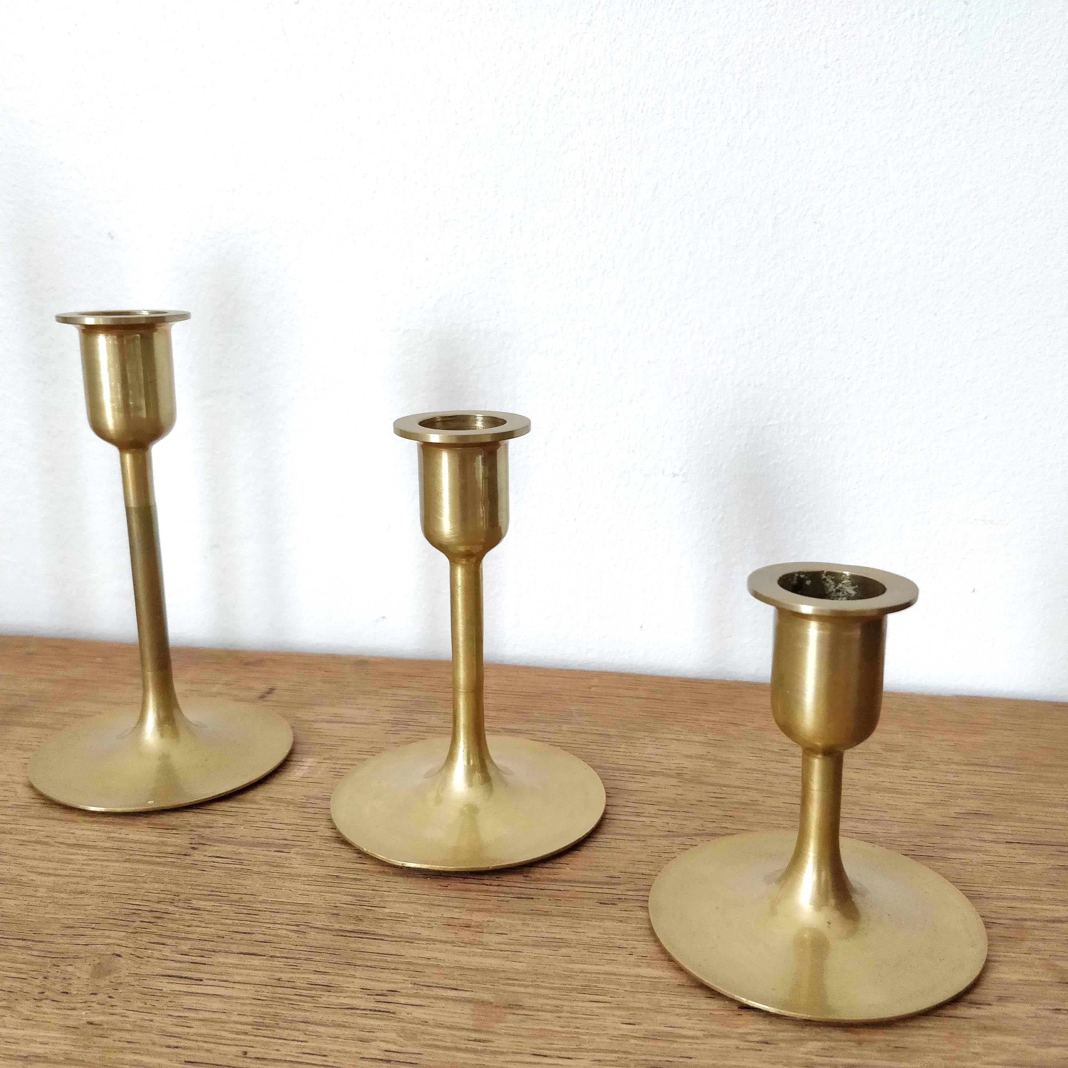 Set of 7 brass candlesticks