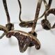 Four patères bronze patinated leafy décor early 20th century