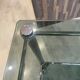 Serving dessert trolley with 2 smoked glass shelves and metal structure.