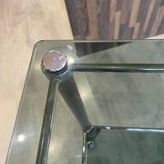 Serving dessert trolley with 2 smoked glass shelves and metal structure.