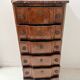 Transitional style chest of drawers in rosewood and amaranth veneer, 20th century.