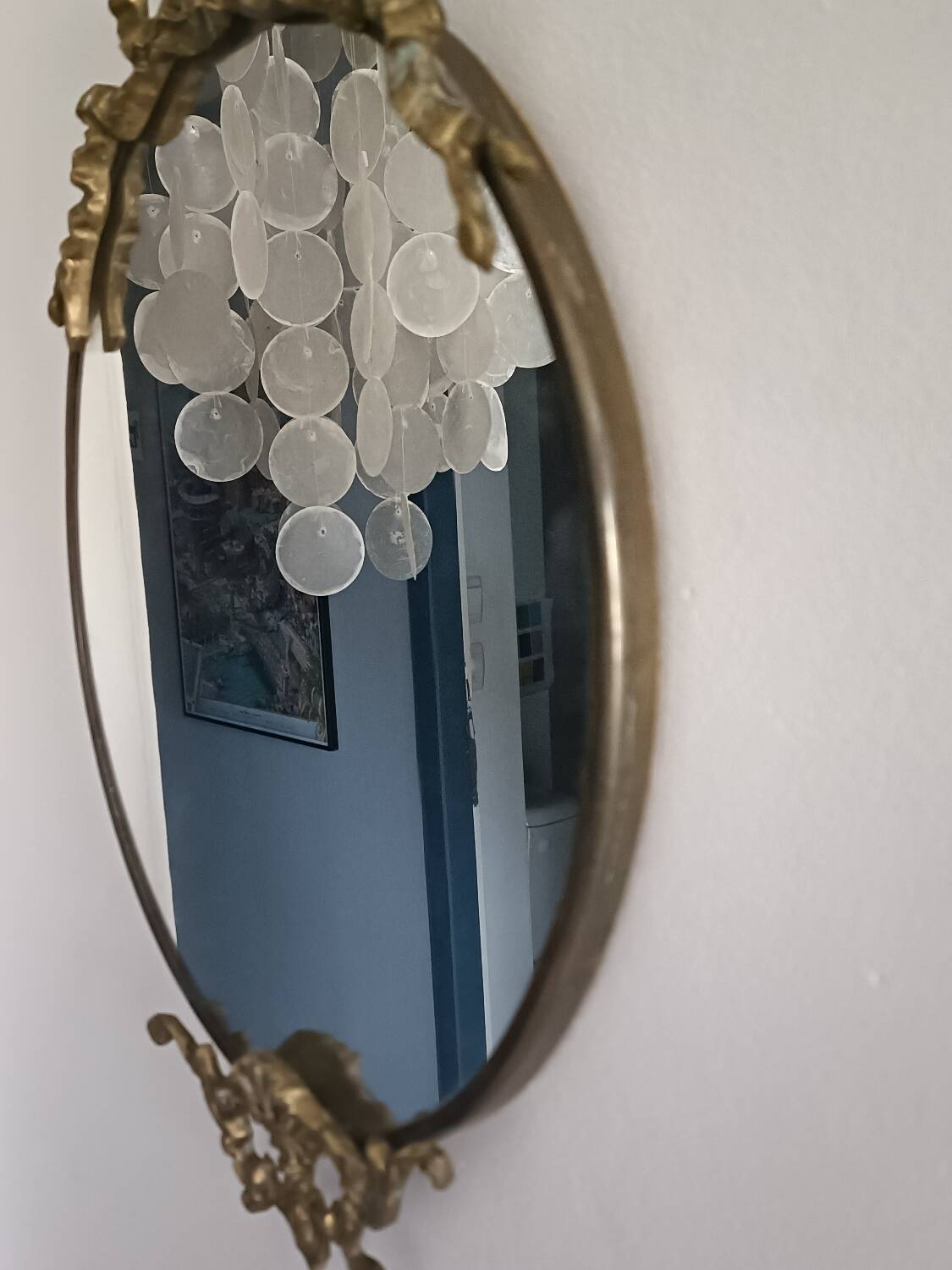 Antique mirror, oval with brass crest