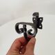 Pair of antique wrought iron coat hooks