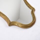 Old wooden mirror gilded with gold leaf
