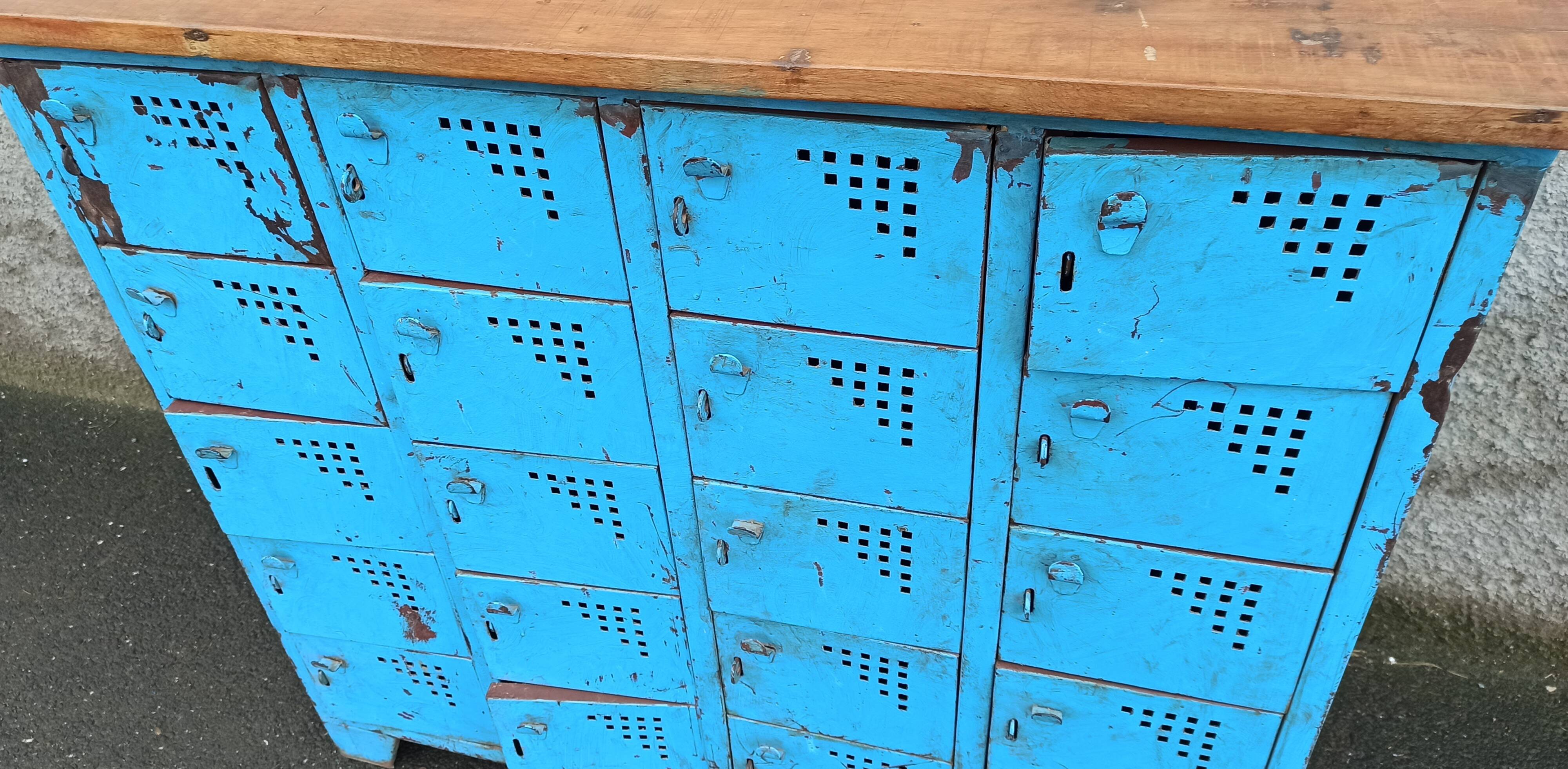 Old blue metal locker with wooden top