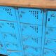 Old blue metal locker with wooden top
