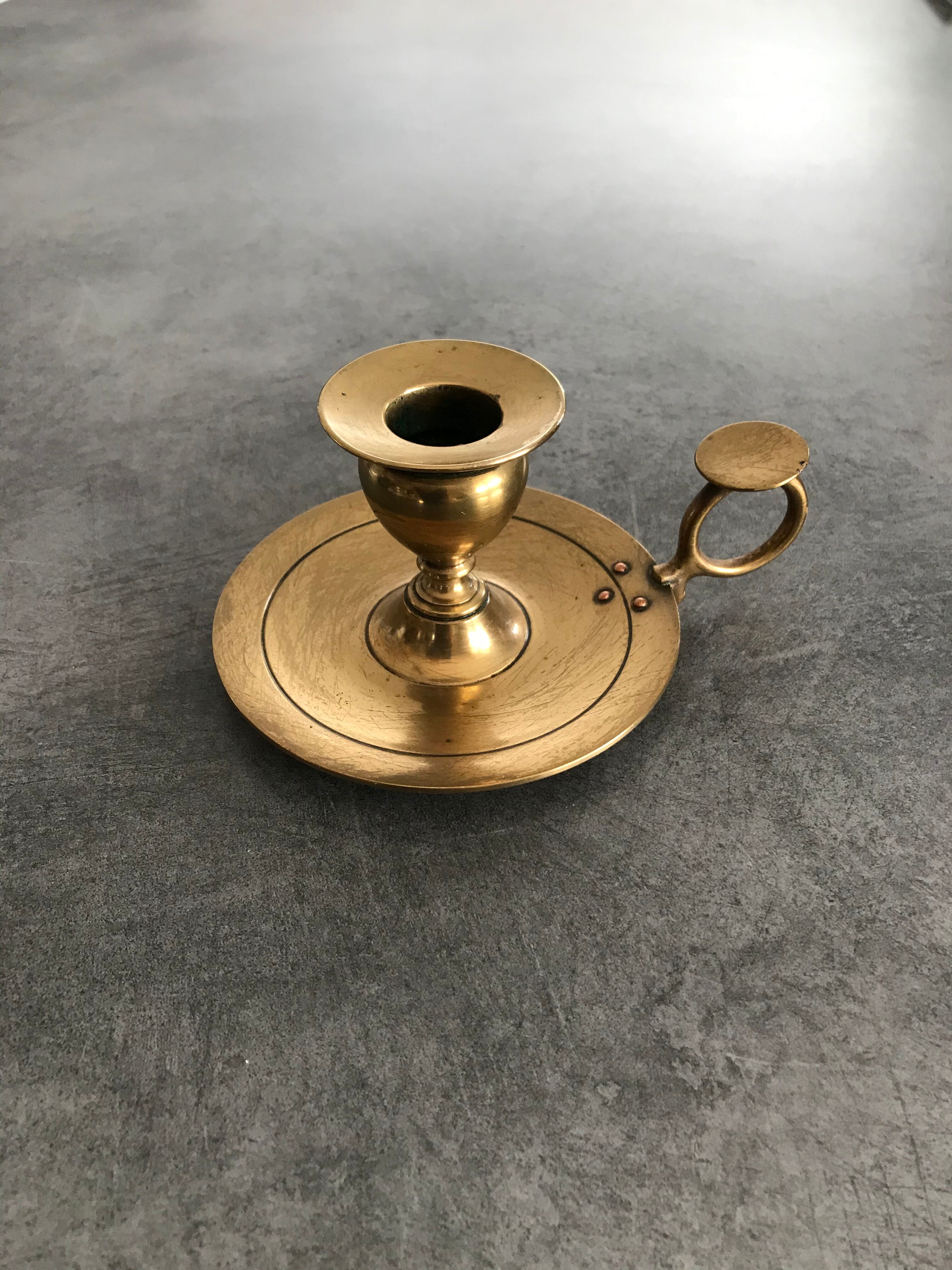 Hand candlestick in massive brasse