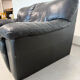 Two-seater black leather sofa — postmodern design