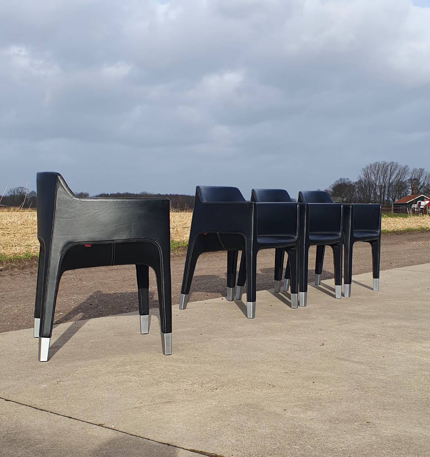 4 black armchairs Plank Claudio Bellini Mon Ami
