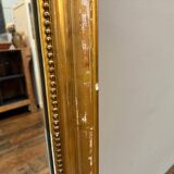 Old gilded fireplace mirror