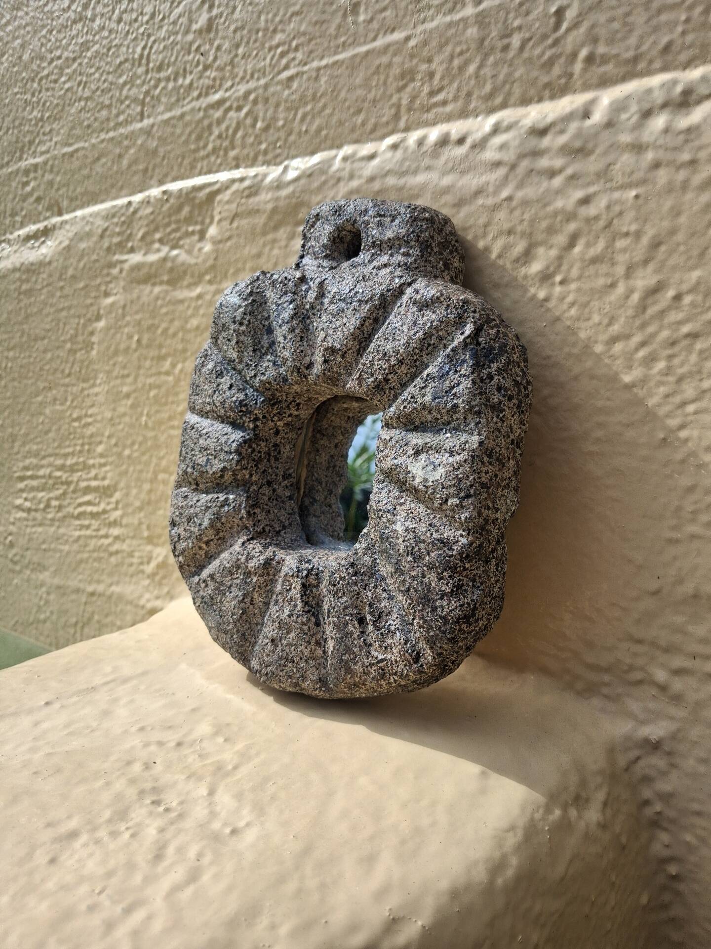 Brutalist mirror in hand-carved natural stone