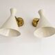 Set of three Italian wall lights in brass and lacquered iron, 1950s design
