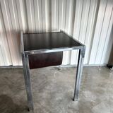 Vintage design magazine rack in chrome metal