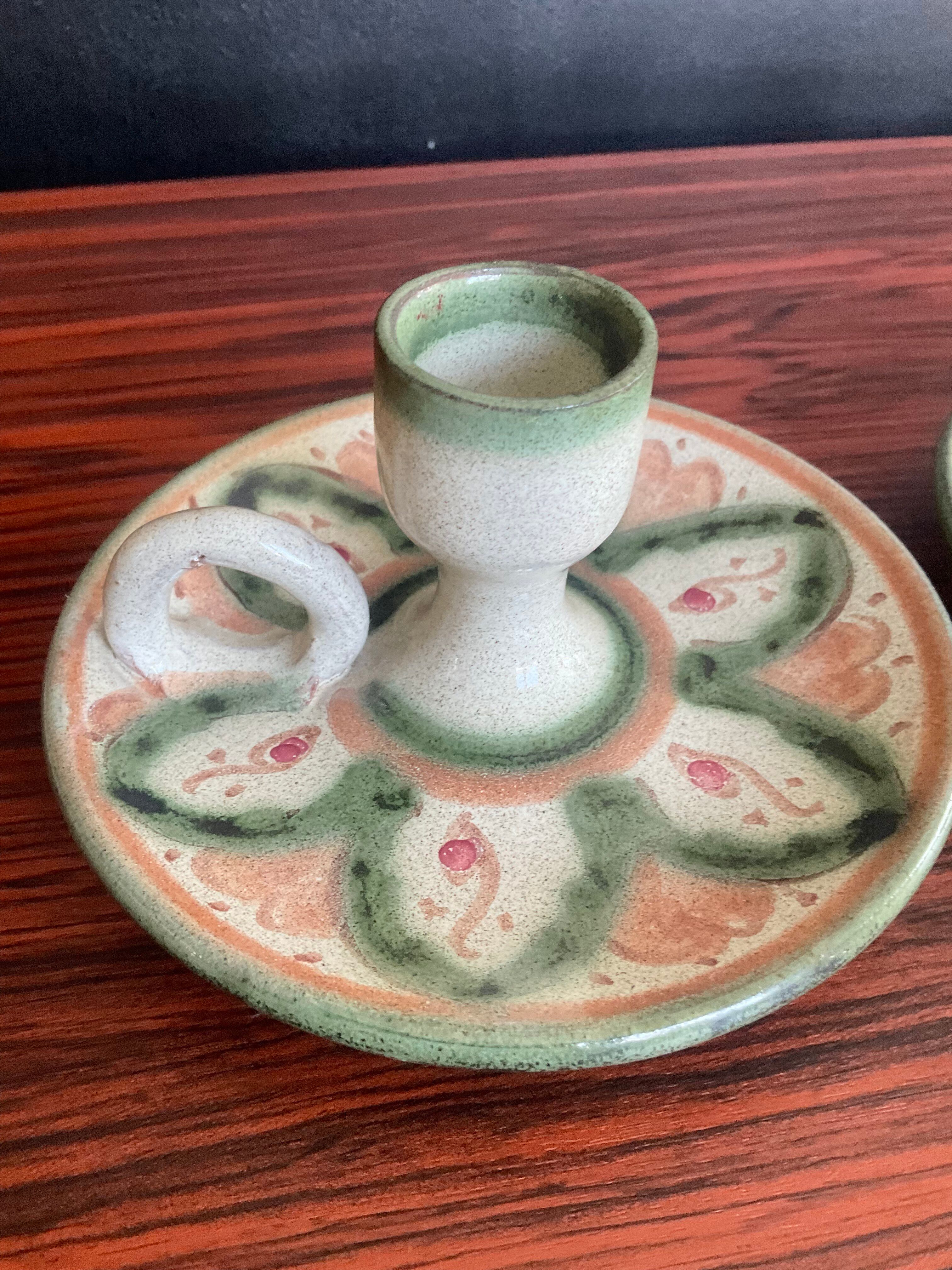 Pair of vintage cave rat candlesticks in glazed terracotta