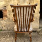 Scandinavian armchair in solid wood with beige fur cushion