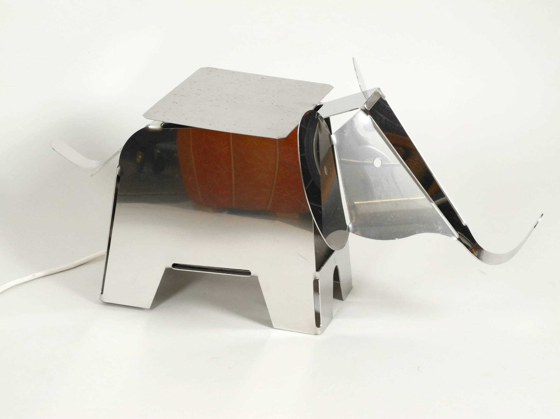 80s heavy metal chrome elephant floor lamp as side table Postmodern design