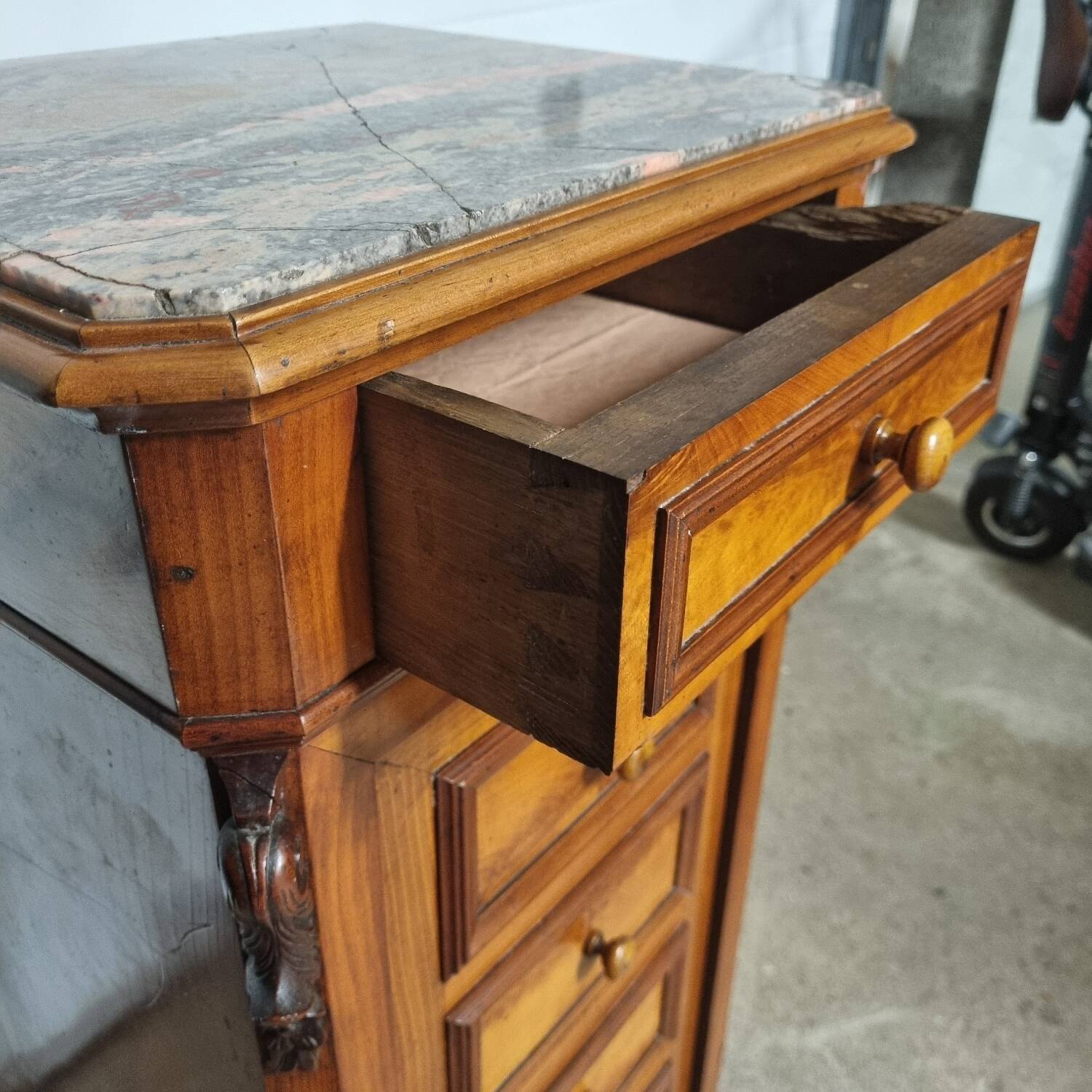 Cherry nightstand with pink marble.