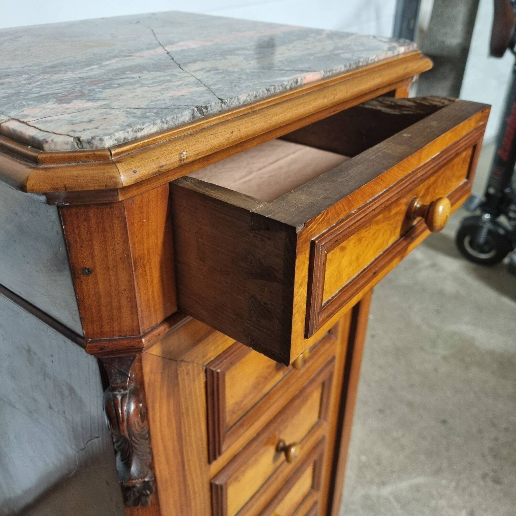 Cherry nightstand with pink marble.