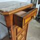 Cherry nightstand with pink marble.