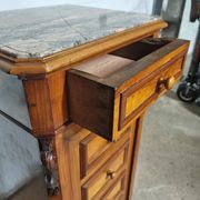 Cherry nightstand with pink marble.