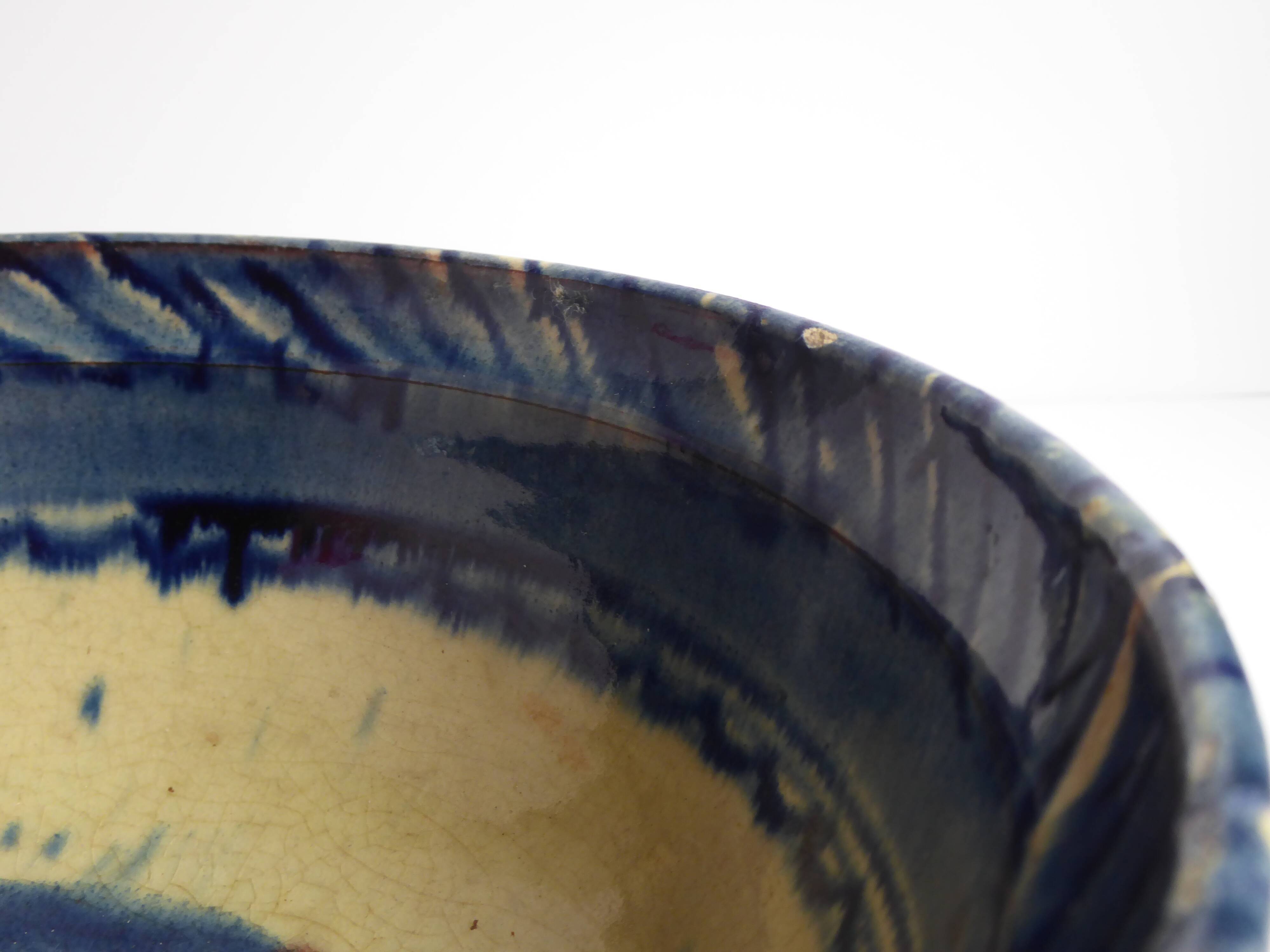 Blue enamelled terracotta cup