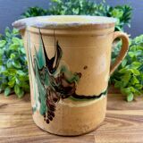 Large vintage ceramic pitcher with abstract green and brown decoration.