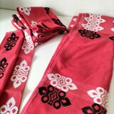 Vintage graphic red tablecloth and 8 matching napkins.