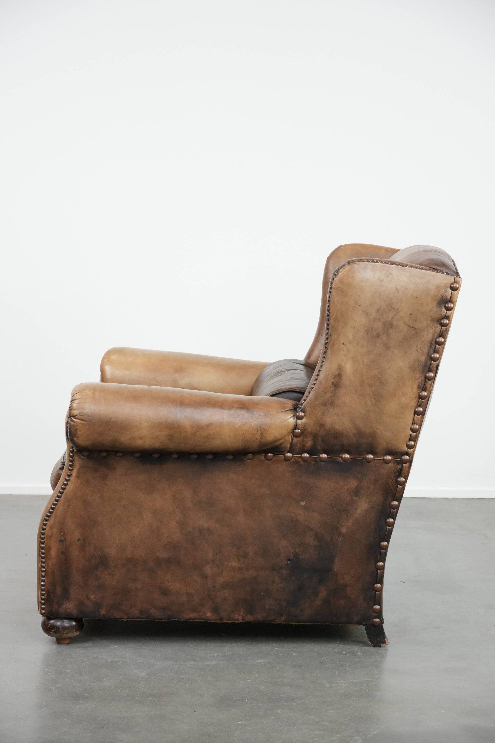 Luxury and large cowhide leather wingback chair in English style