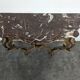 Console Louis XV en bois doré sculpté dessus marbre rouge