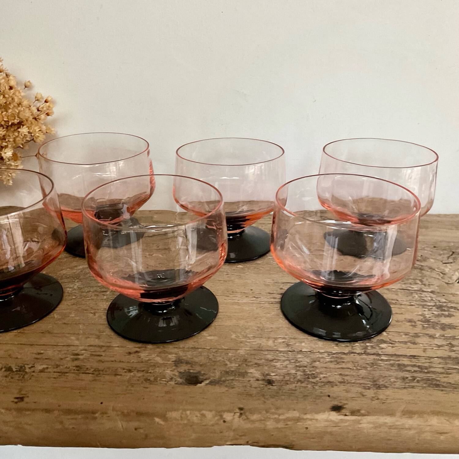 6 pink bowls with black stems